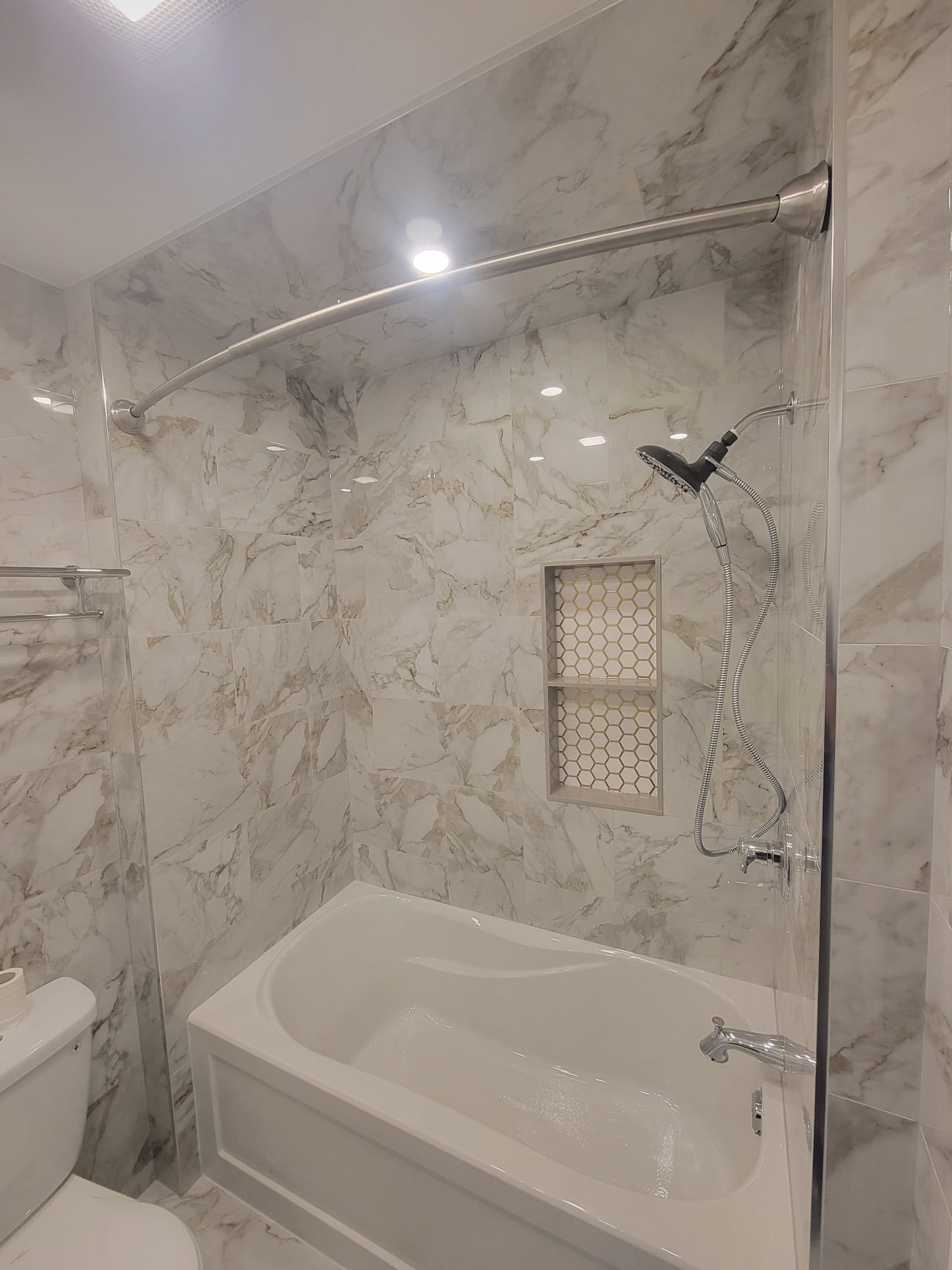 Marble-look tile surround and freestanding tub
