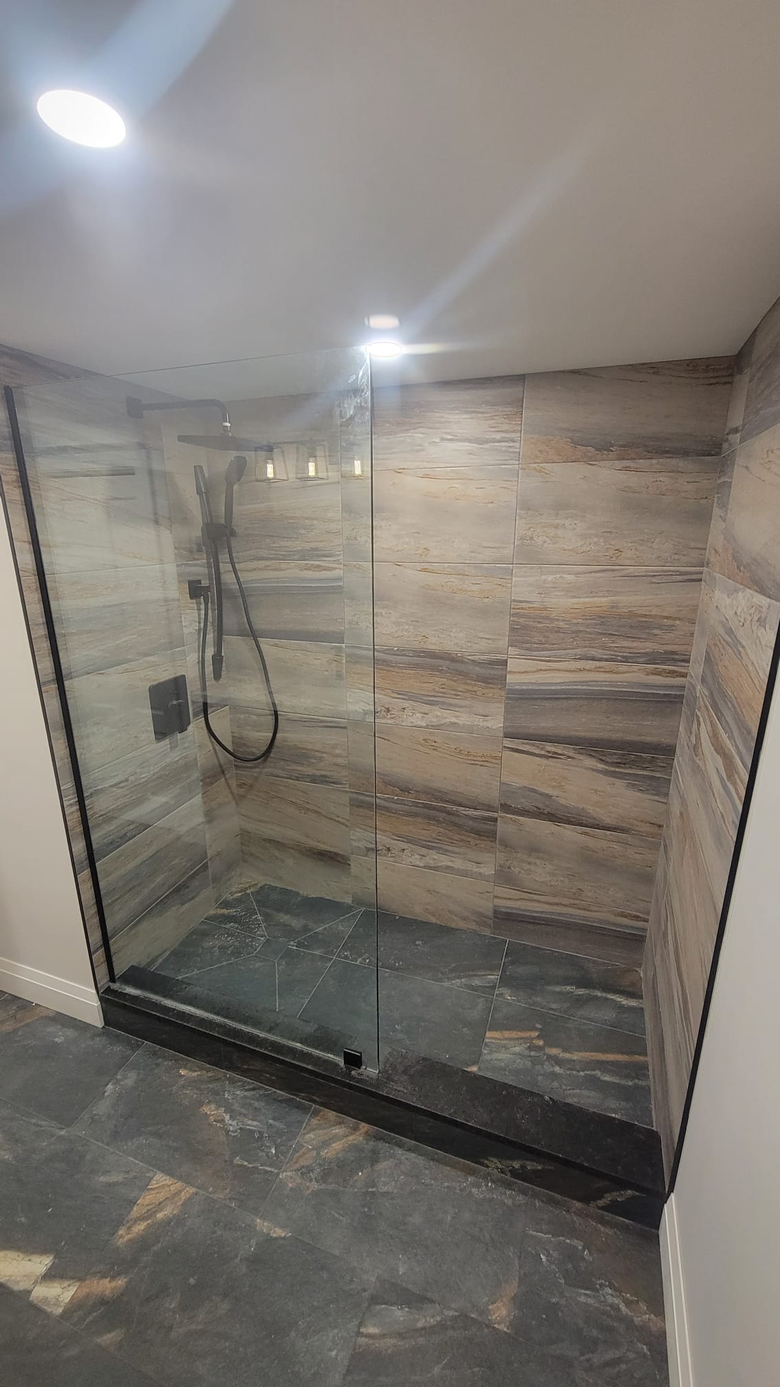 Modern walk-in shower with large format tile