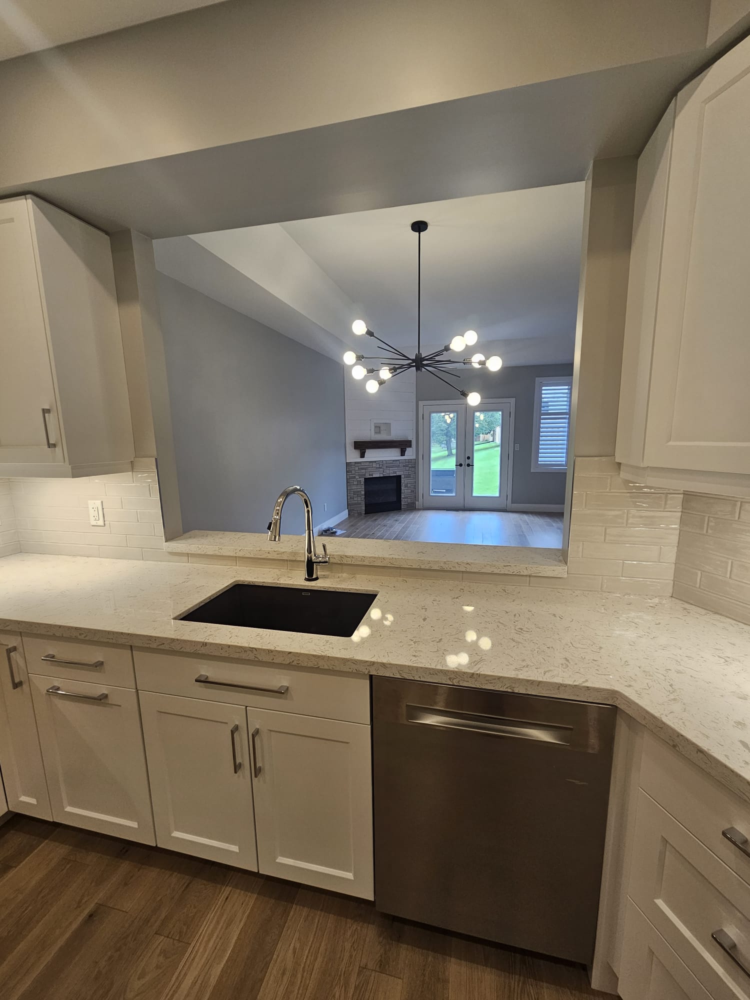 Kitchen pass-through opening to adjacent room