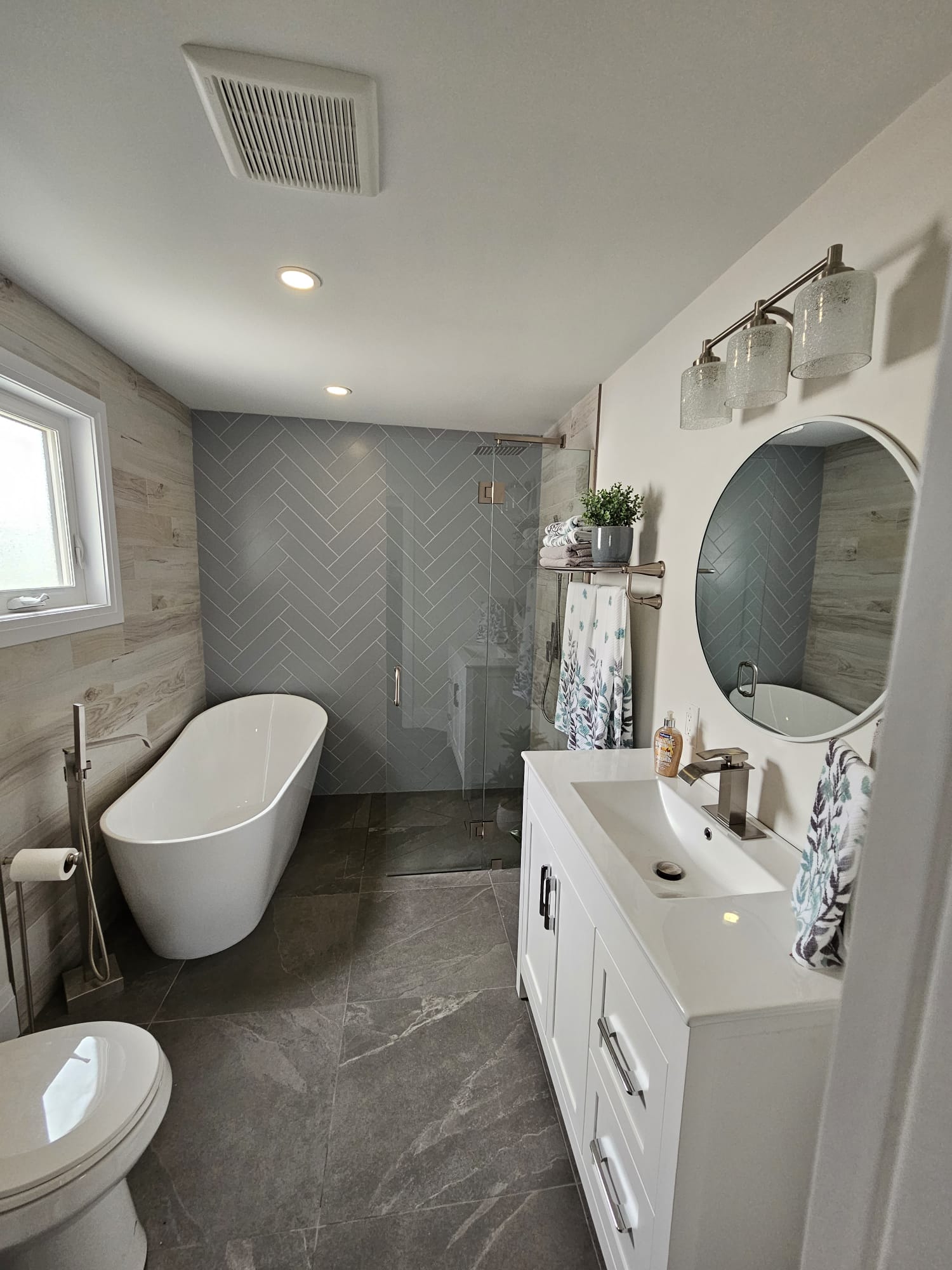 Bathroom vanity with sink and adjacent shower