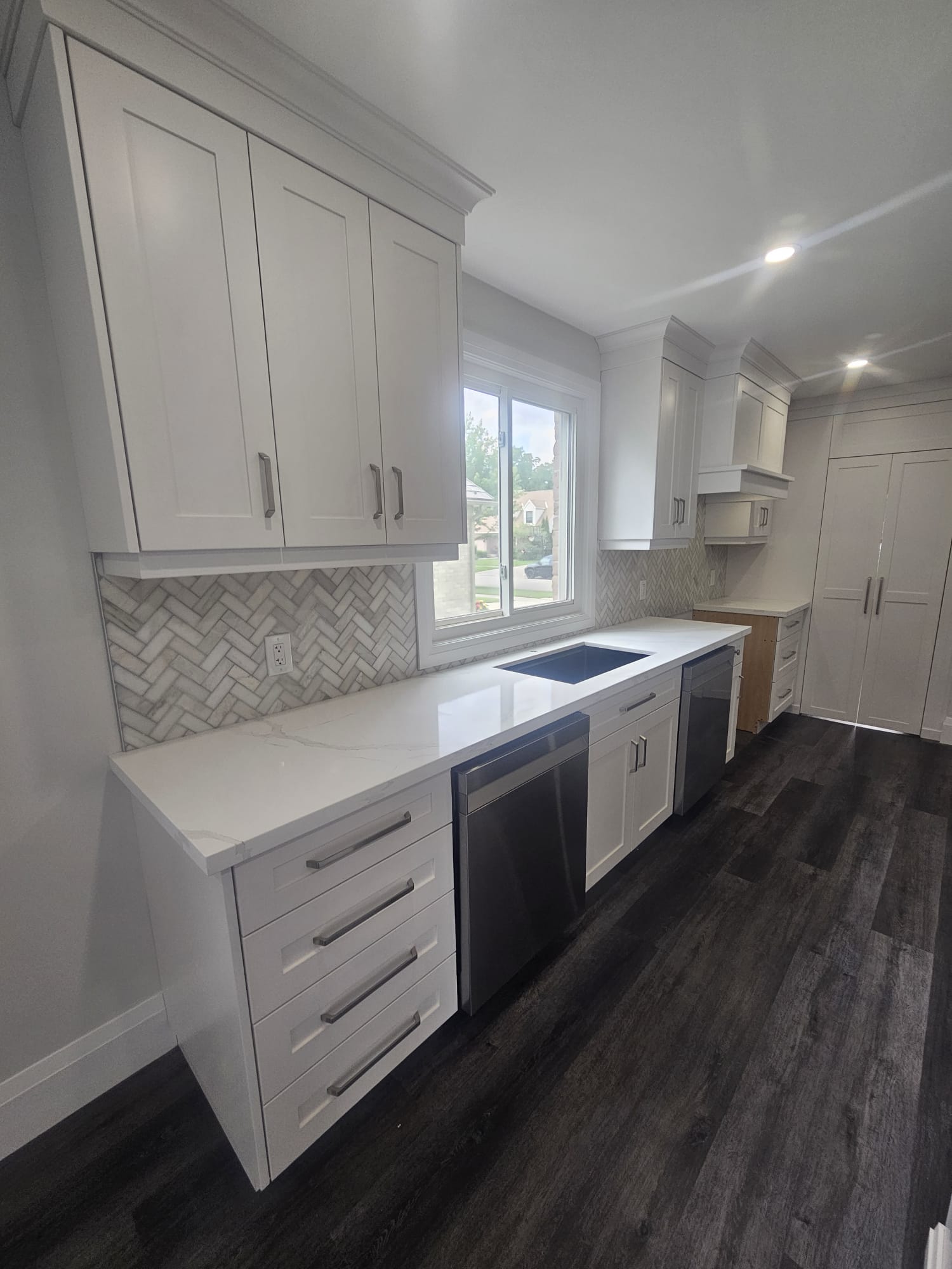 Kitchen counter run with herringbone backsplash